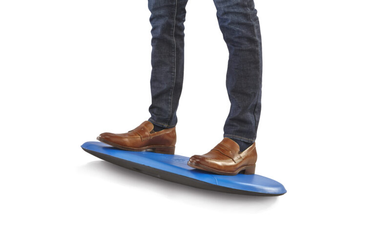 Safco Kick balance board under a standing worker's feet