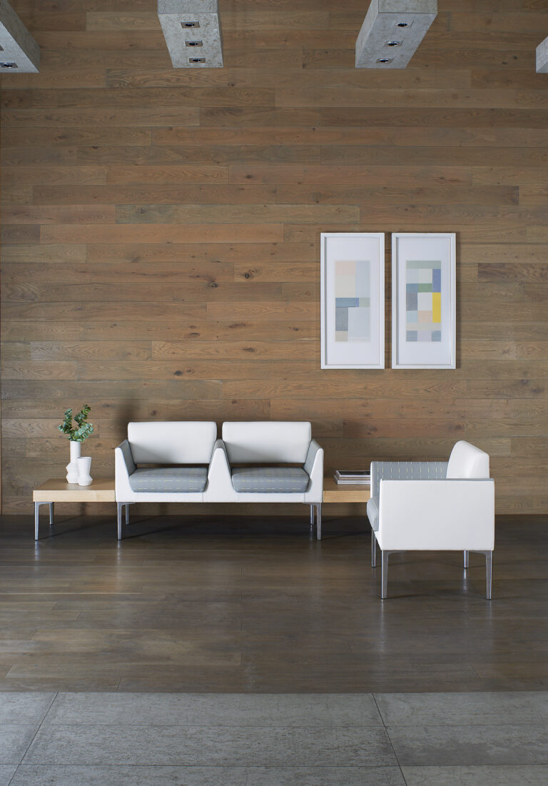 Savina lounge seating against a wood wall