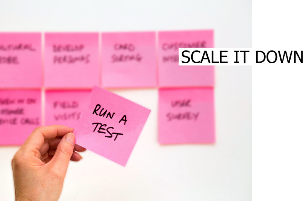 Sticky notes with Run a test written on one, captioned Scale it down