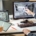 Two people sit next to each other at a computer desk. The man points to an office layout on the desktop while the woman holds a tablet.