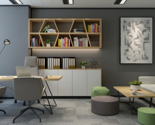 A modern office with a wood desk, gray chairs, a white sofa, green plants, and geometric shelves filled with books.
