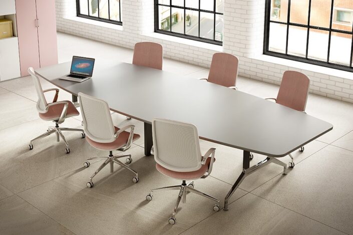 Boss Design conference table with white and coral meeting chairs